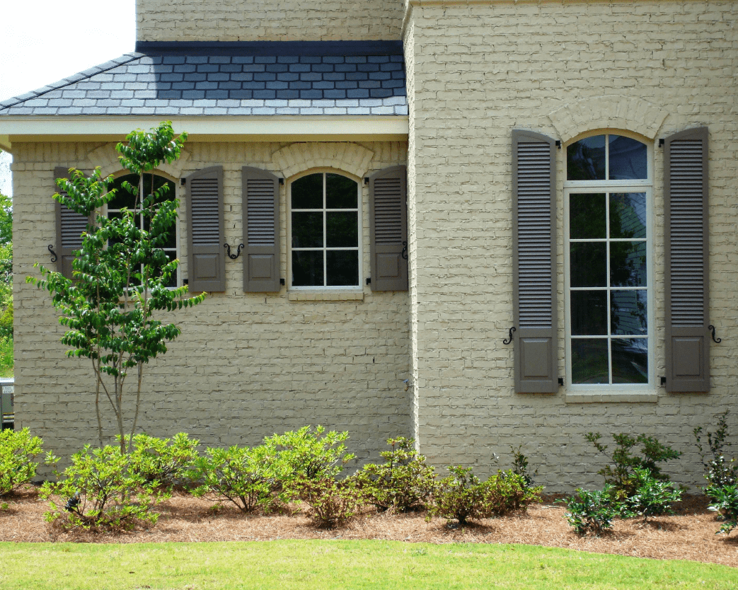 Combination exterior shutters built by Dwell Shutter & Blinds